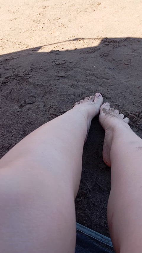 My dirty feet in the wet sand