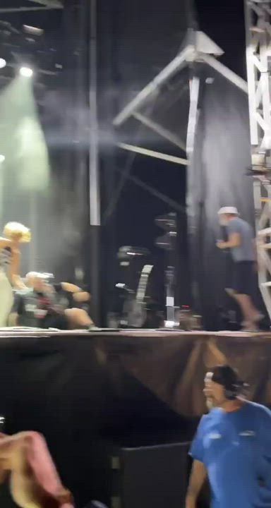 Singer Golden Showers a Fan On Stage at Concert