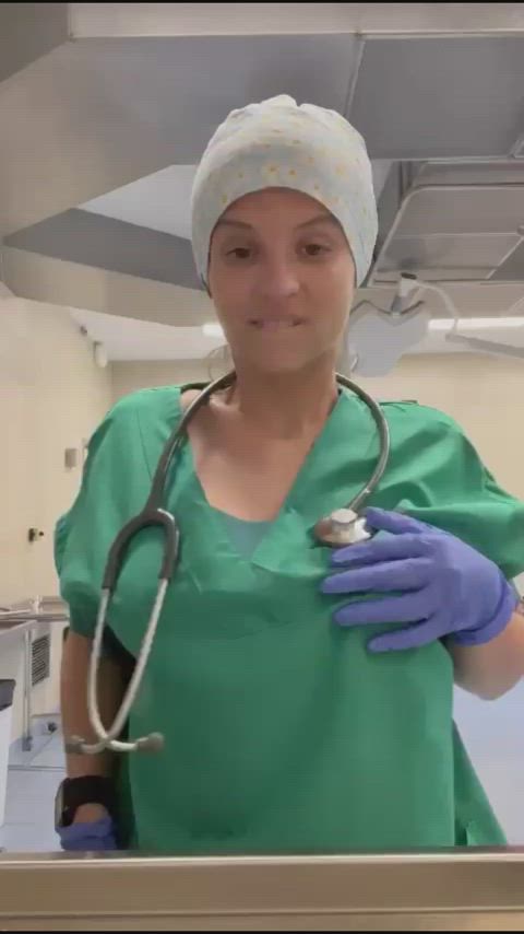 Just a naughty nurse dropping her tits out at work