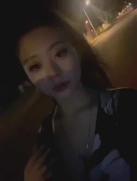 Hot Asian babe pulling her big boobs out in public